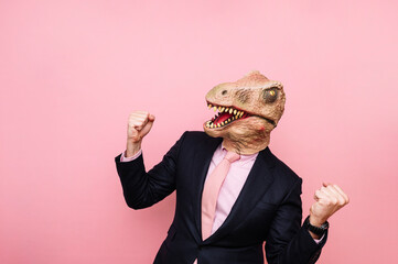 Euphoric lizard-headed man with raised fists