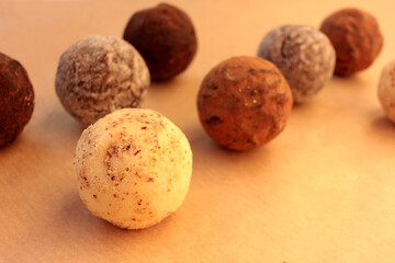 Chocolate truffles on a craft paper background. View from overhead