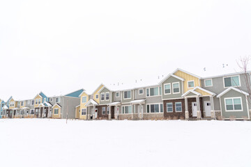 Facade of apartment houses in a landscape of snowy neighborhood in winter