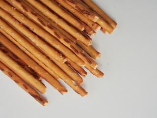 breadsticks in a cup on a wooden background