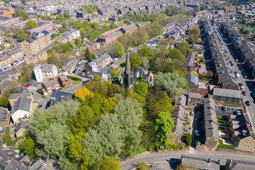 Fototapeta na wymiar Aerial photo of the village of Morley in Leeds, West Yorkshire in the UK, showing an aerial drone view of the main street and historical old town hall and clock tower