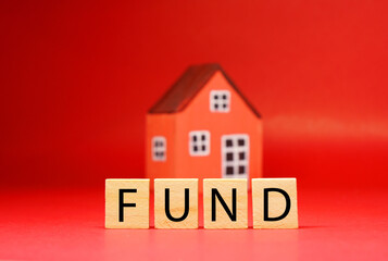 Fund investment word concept in  Shopping Home Property 2021 , Mockup with House model, Shopping cart - Red background - home new year - Red concept of Real Estate, Property for Sale and Buy