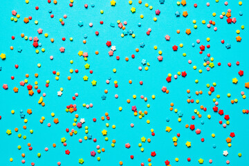 Colorful cake decoration background, blue  background with colorful candy.