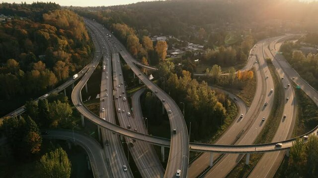 Amazing Fall Season Sunset Aerial View as Cars Travel Freeway Overpass Ramps