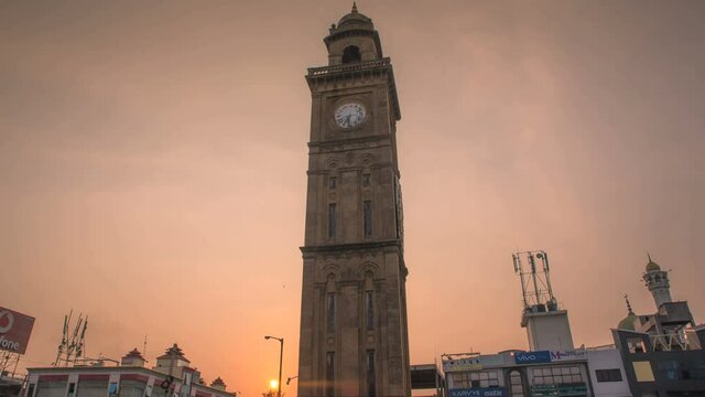 Time-lapse of 100 year old Indo-Saracenic Clock Tower (also known as Dodda Gadiaya and Silver Jubilee Clock Tower) with numerals in Kannada language at Mysore, Karnataka, India	
