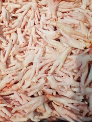 A large number of chicken feet sold in the market