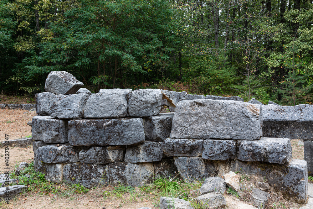 Wall mural old stone ruins and trees in the mountain