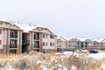 Apartment buildings and townhouses at a snowy neighborhood in winter season