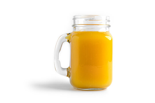 Orange juice in mason jar on a white background. . High quality photo