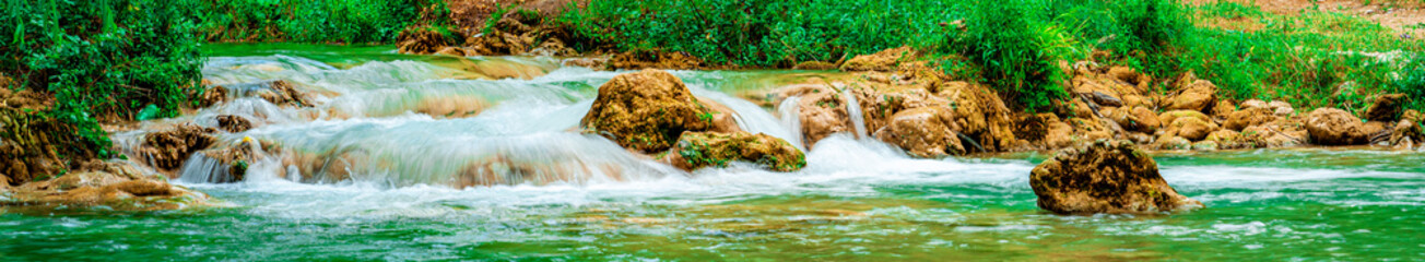 Colorful waterfall landscape. Gurleyik stream with long exposure, Mihaliccik, Eskisehir, Turkey. Panoramic shot. High resolution sharp photo. Panorama banner.