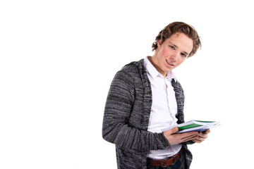 Student on a white background. Young attractive guy and books.