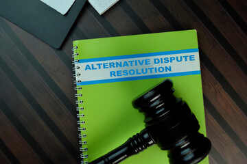 The book of Alternative Dispute Resolution isolated on Wooden Table. Law concept