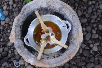 Equipment for batik. Frying pans and canting are used for the process of drawing batik.