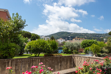 Fototapeta na wymiar Sorrento, Italy - July 13 2019: Landscape of the coast viewed from the park at harbour