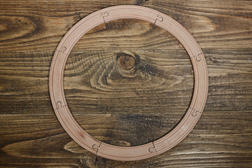 wooden railroad toy on table.