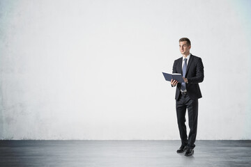 Young European businessman with planner, mock up