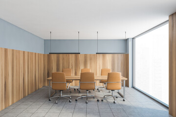 Grey and wooden room with chairs and wooden table near window