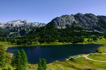 Fototapeta na wymiar amazing mountain lake with mountains and green nature