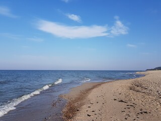 Sandy shore of the blue Baltic Sea