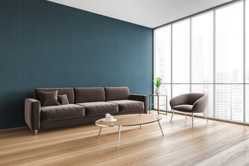 Blue living room corner with sofa and armchair