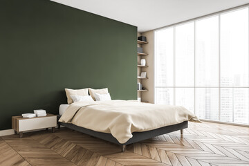 Green and beige bedroom, bed with linens bookshelf near window