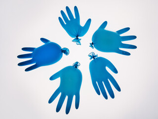 Covid-19 art. Social distance. Self isolation. Pandemic hygiene. Blown blue protective medical hand gloves floating on air in circle isolated on white background.