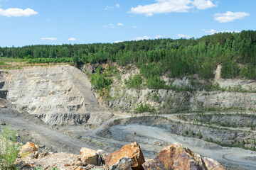 The production of graphite. Deep quarry for the extraction of minerals.