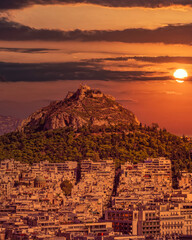 Greece, Athens panorama with Lycabettus hill under dramatic sky