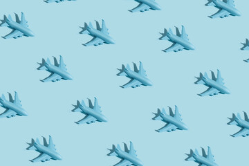 Creative layout made with blue passenger airplane on sky blue background. Minimal travel of holiday vacation concept. Flat lay, top view.
