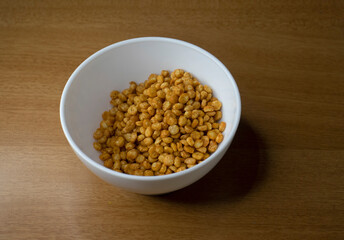 Fototapeta na wymiar Fried and Spicy Chana Dal Masala is a popular snack. served in a bowl. selective focus
