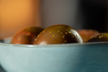 Healthy breakfast or dinner with red tomatoes on blue bowl
