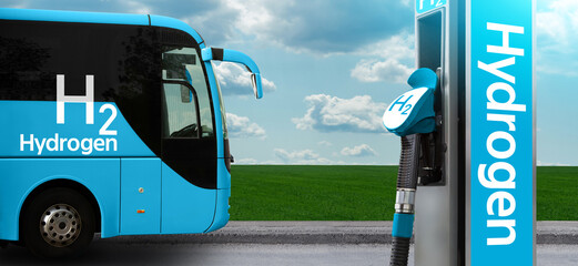 Tourist bus on hydrogen fuel with H2 filling station on a background of green field and blue sky