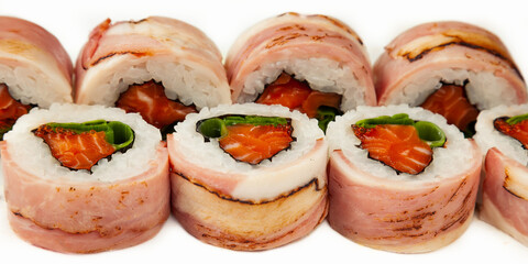 Sushi roll with bacon and salmon on a white background, ingredients seared bacon, salmon, green onions, flying fish roe, Iceberg sauce, rice, nori. Traditional Japanese food. For the restaurant menu