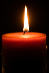 burning candle in the dark