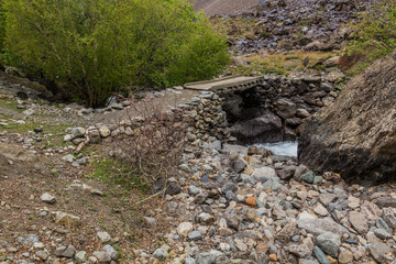 Footbridge in Jizev (Jisev or Jizeu) valley in Pamirs mountains, Tajikistan