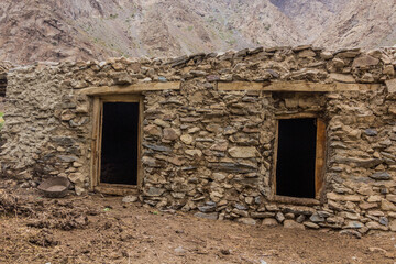 Fototapeta na wymiar Stone building in Jizev (Jisev or Jizeu) village in Pamirs mountains, Tajikistan