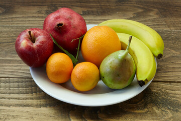 Naklejka na ściany i meble fruits on wooden table. healthy diet.