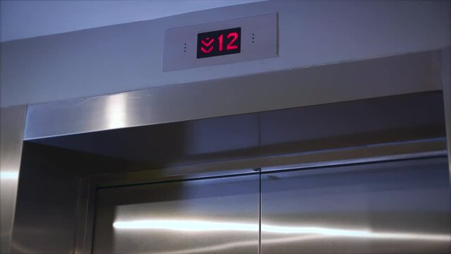 Metal doors smoothly open and close. Silver new elevator on the 1st floor 4k video. Opening the door is an elevator. The elevator doors open.