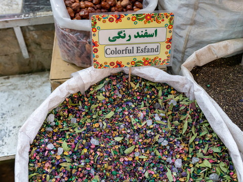 Colorful esfand sold in a traditional Iranian market. Persian writing translates for colorful esfand