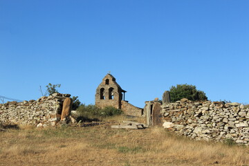 
Stone church under blue sky in a small town