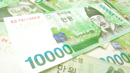 Obraz premium Korean money 10,000 Won cash currency background. The concept of Korean cash currency.