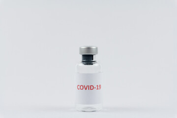 Corona virus vaccine in bottles on white background, COVID19