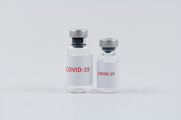 Corona virus vaccine in bottles on white background, COVID19