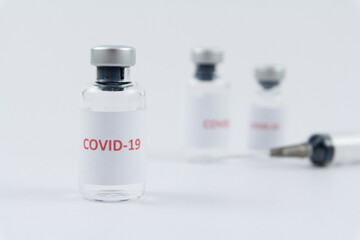 Corona virus vaccine in bottles on white background, COVID19