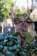 Historic Jesus on the winter mystery old Prague Cemetery, Czech Republic