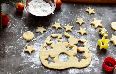 Cooking cookies for the new year and christmas. Flour and dough, cookie cutters. Top view. Copy space