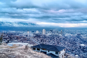 Salt Lake City aerial landscape with snowy mountain and overcast sky views