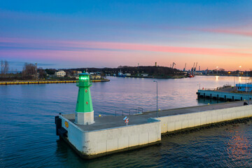 The lighthouse at the exit to the Baltic Sea in New Port at sunset, Gdansk. Poland © Patryk Kosmider