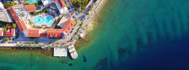 Aerial drone ultra wide photo of famous seaside village well known for thermal springs of Aidipsos, North Evia island, Greece