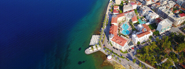 Aerial drone ultra wide photo of famous seaside village well known for thermal springs of Aidipsos, North Evia island, Greece